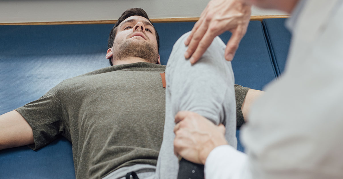 Young man in physical therapy for his leg.